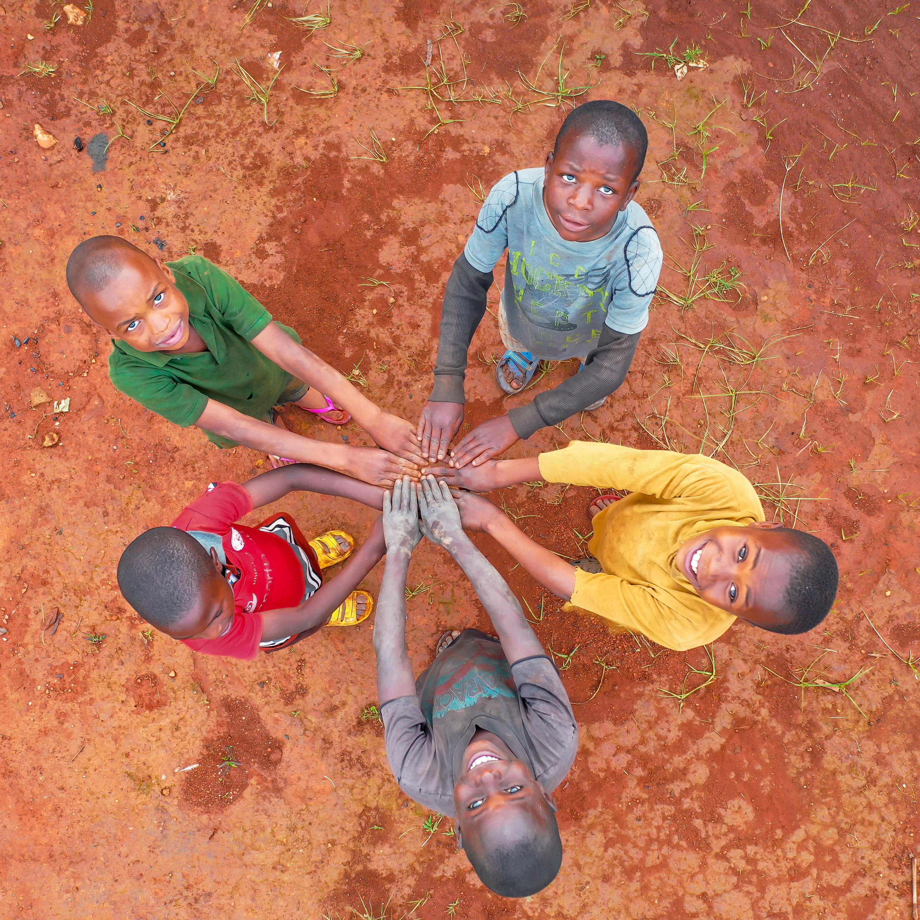Kids holding hands and Laughing to camera